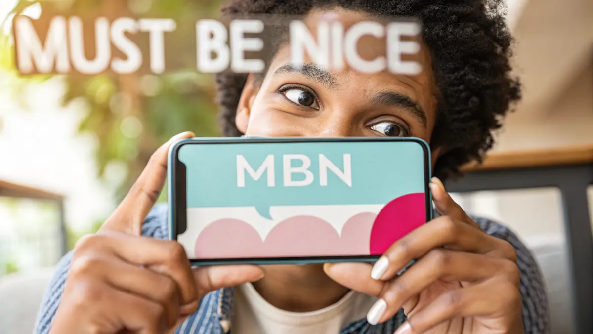 Person using smartphone checking social media with MBN acronym text overlay on screen display